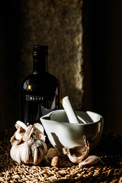 mortar pestle, garlic and olive oil