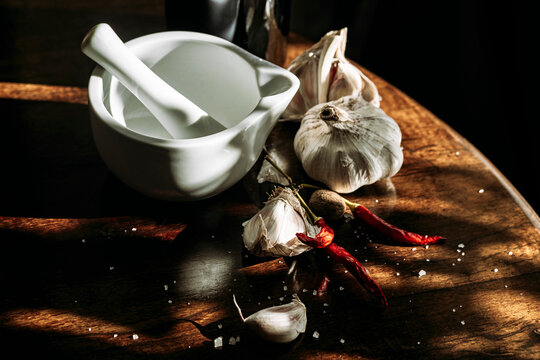 mortar pestle, garlic  and chili pepper