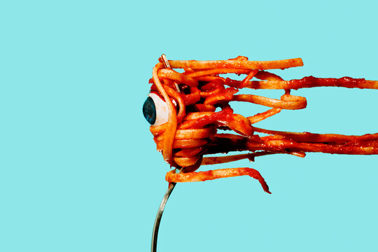 eye in a bunch of tagliatelle in a fork