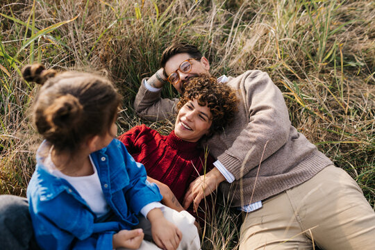 Family Lying in Grass