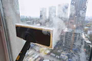 Modern steam-cleaning device used during window cleaning