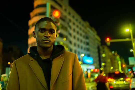 Handsome Black Man On The Street Of The City At Night.