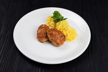 Chicken meat cutlet with mashed potatoes on white plate