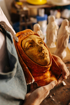 Artisan working with clay in workshop