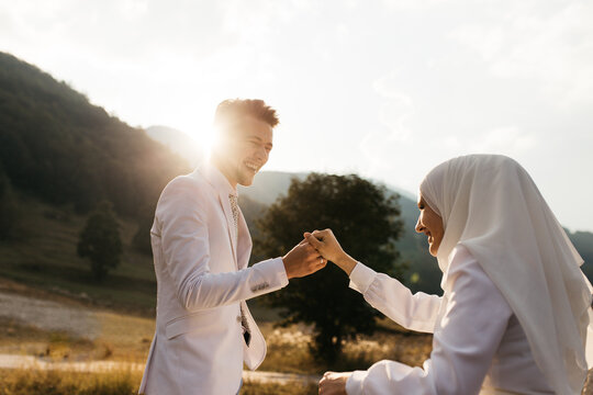 Happy couple sitting in the mountains 
