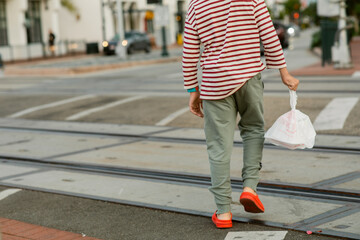 Boy wearing takeaway food bag