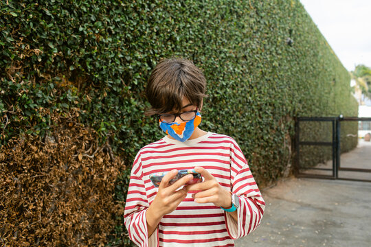 Young man checking phone outdoor
