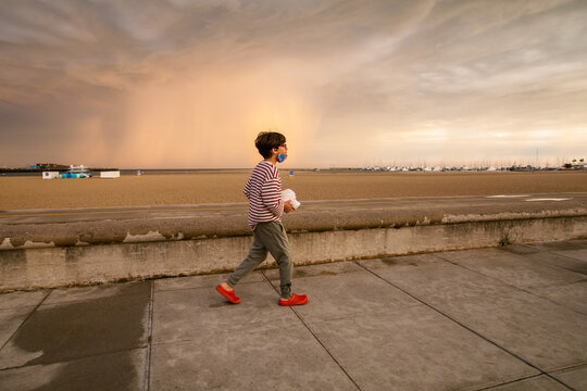 Boy taking a walk waterfront