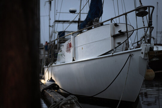 White boat on a snowy winter dock in British Columbia