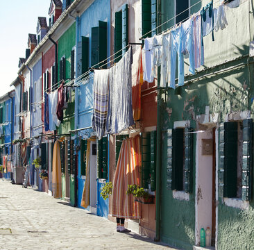 Burano, Venice - local resident, colorful washing drying