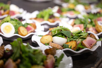 salad with egg, tuna and lettuce leaves