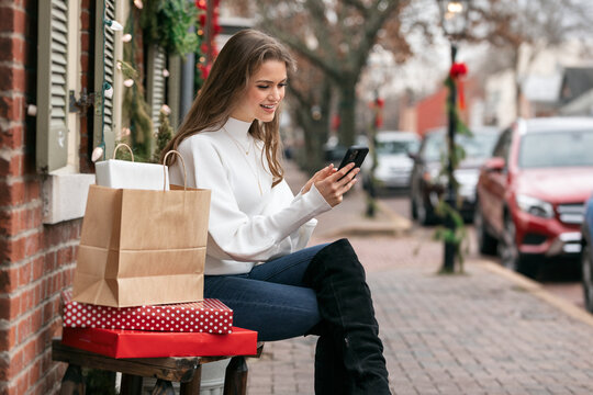 Woman Sits And Holiday Shops Online