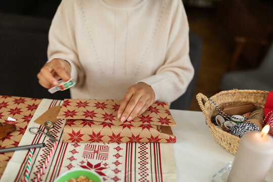 Female packing Xmas gift at home