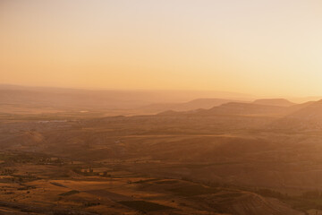 Fototapeta premium Picturesque summer view Scenic on landscape view of geologic formations of Cappadocia. Amazing shaped sandstone rocks. Famous touristic place and romantic travel destination..
