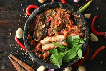 A spicy and delicious Indonesian chili sauce, with fresh basil leaves makes eating even more delicious.
