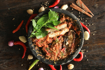 A spicy and delicious Indonesian chili sauce, with fresh basil leaves makes eating even more delicious.