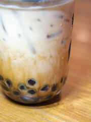 Iced bubble tea for ready-to-drink in plastic cup.