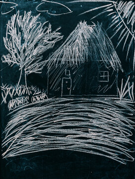 Children's chalk drawing on a blackboard.
