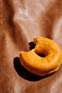 nibbled donut on leather