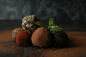 Concept of sweets with truffles on dark textured table