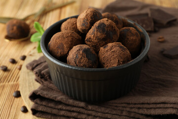 Concept of sweets with truffles on wooden background