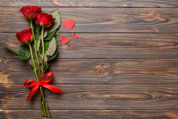 Valentine day composition with rose flower and red heart on table. Top view, flat lay, copy space Holiday concept