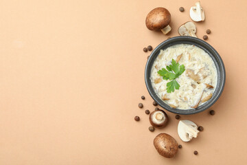 Concept of tasty food with mushroom sauce on beige background