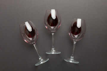 Many glasses of red wine at wine tasting. Concept of red wine on colored background. Top view, flat lay design
