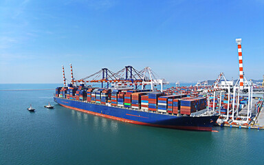 Aerial top view containers ship cargo business commercial trade logistic and transportation of...