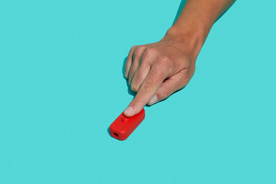 man flips a red inline cord switch