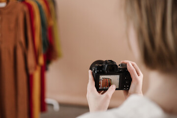 Woman taking photo of fashion designer