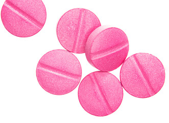 Pink pills isolate on white background