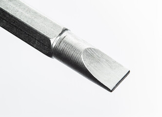 Standard tip Screwdriver close up over size image on white background. Show texture and detail from metal turning processs.