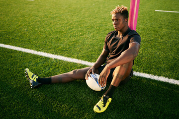 Black rugby player on sports field