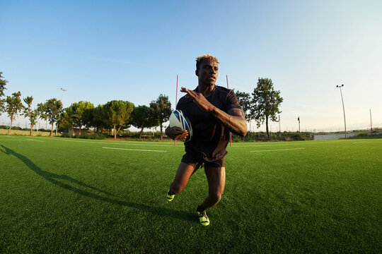 Black rugby player training on field