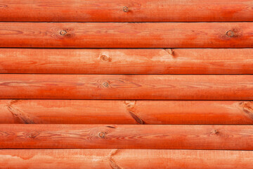 Grunge wood texture. Red paint wooden log wall background. Rustic tree desk with knots pattern. Countryside architecture wall. Village building construction.