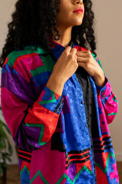 Model buttoning vintage blouse
