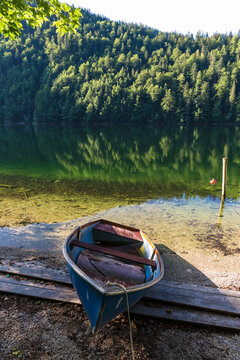 Rowboat left on shore of Lake Toplitz in summer