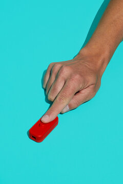 man flips a red switch