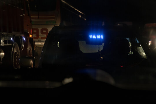 Taxi on the highway at night.