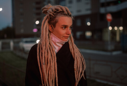 Winter Portrait of young woman with dreadlocks 