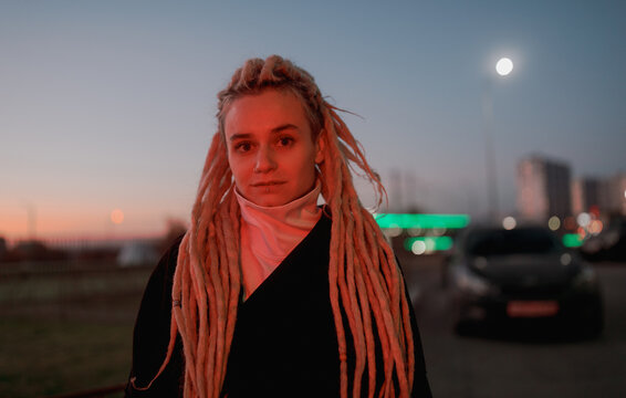 Winter Portrait of young woman with dreadlocks 