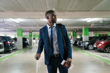 Black entrepreneur in airport car park