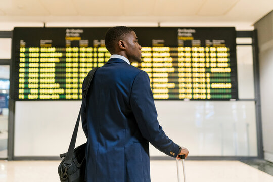 Businessman waiting for flight at the airport