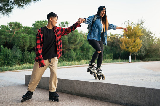 Portrait of three multiethnic young millennial skating