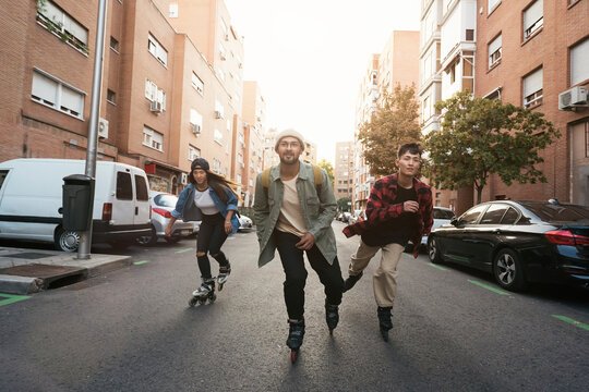Young friends boys skating