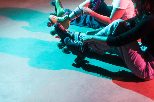 Roller skaters tying her laces