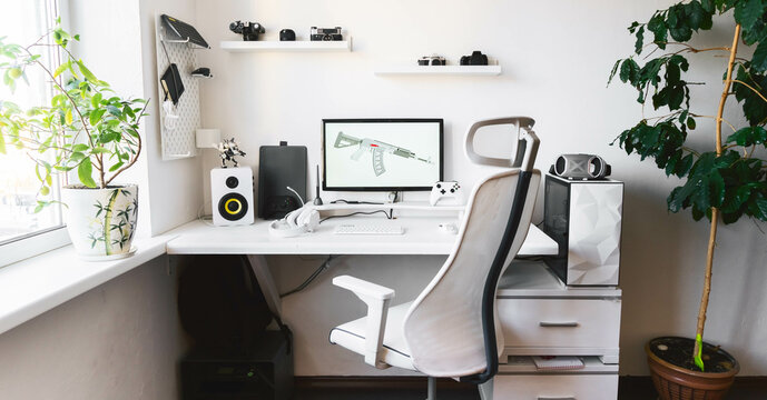 General view home workplace of gamer with computer and gamepad. 