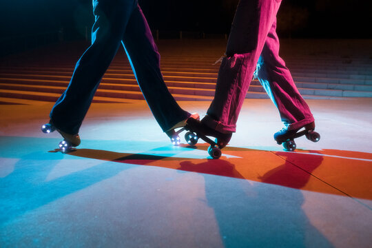 Vintage roller skaters dancing together
