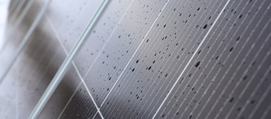 Solar panels Photovoltaic cells with water droplets. Solar panels are an alternative energy.